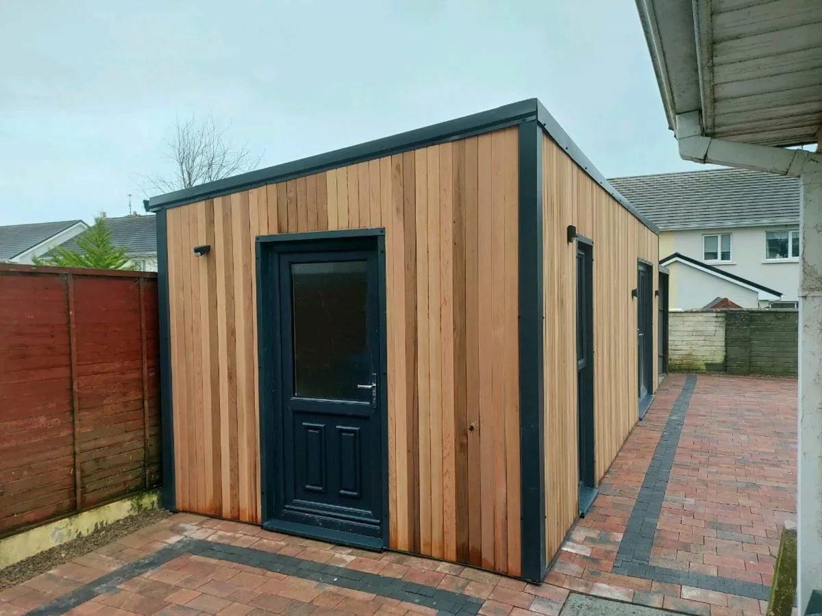 Cedar-clad garden studio with side entry door and anthracite trim