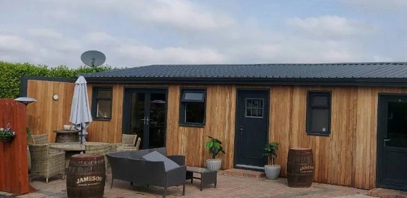 Multi-purpose cedar pavilion on a clear day